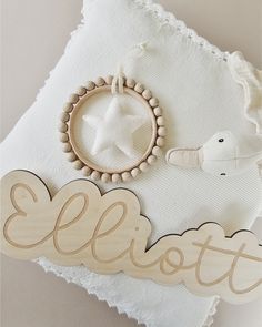 a wooden sign that says ellots and a star hanging from it's side