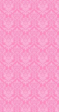 a pink wallpaper with an ornate design