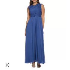 a woman in a long blue dress