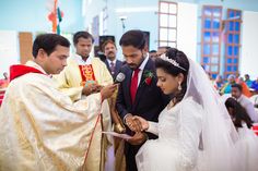 a bride and groom exchanging vows at their wedding ceremony