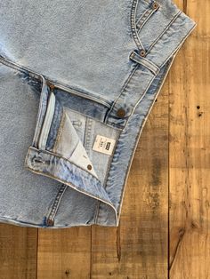 "High waisted 90's denim shorts. Made by Levi's in light blue denim wash. Shorts are in great clean condition. Perfectly worn in with light naturally distressed character. Measurements are taken zipped or buttoned up and laid comfortably flat then x 2 for total circumference (inches) Tag Size 12 Levis 941 100% Cotton Waist 33\" Hips 43\" Length 14\" Inseam 3.5\" Rise 11\" leg opening circumference 25.5\" All items are free of rips, tears, holes, and stains unless otherwise noted." High Waist Light Wash Jean Shorts With Five Pockets, Light Wash Rigid Denim Cutoff Bottoms, Retro Cutoff Light Wash Jeans, Retro Light Wash Cutoff Jeans, Straight Leg Light Wash Jean Shorts With Pockets, Light Wash Denim Straight Leg Jean Shorts, Retro Straight Leg Denim Jean Shorts, 90s Style Light Wash Cutoff Jeans, 90s Light Wash Cutoff Jeans