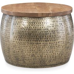 a round metal table with a wooden top on a white background, it is made from wood and has holes in the surface