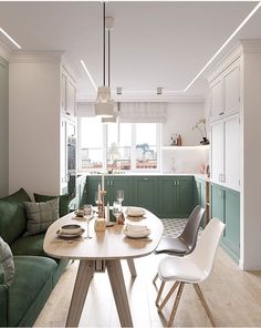 a green couch and table in a small room