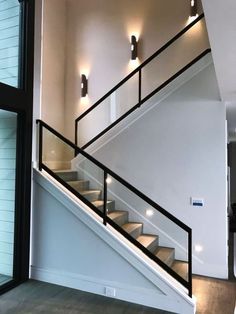 the stairs in this house have been painted black and white with red lettering on them