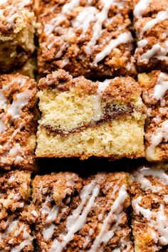 a close up shot of cinnamon roll cake with icing on the top and bottom