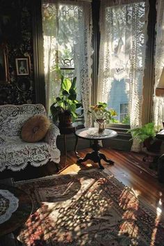 the sun shines through the windows in this living room filled with furniture and decor