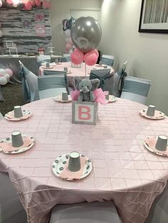 a table set for a baby's first birthday party