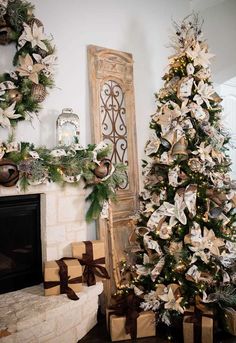 a decorated christmas tree sitting next to a fireplace