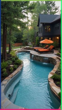 an outdoor swimming pool surrounded by landscaping and trees