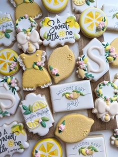 decorated cookies are arranged on a table for a baby's first birthday or special occasion