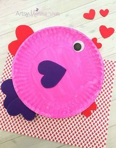 a paper plate shaped like a pink fish