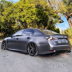 a silver car parked on the side of a road