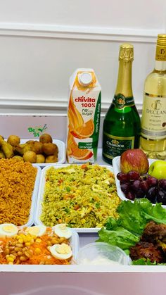 an assortment of food and drinks on a table