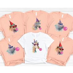 a group of children's tshirts with giraffes on them