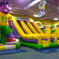 an inflatable bouncy park with slides and bouncers