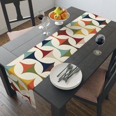 a table with place settings and fruit on it