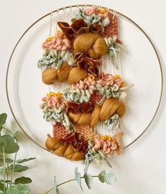 a white plate topped with yarn and flowers