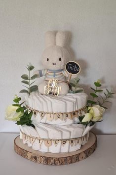 Pampertaart Nijntje nature aesthetic roses plants oh baby diaper cake Diaper Present Ideas, Baby Shower Gifts Gender Neutral, Diaper Ideas For Baby Shower Diy, Baby Shower Diaper Cake Ideas, Pampers Cake, Diaper Decorating Ideas, How To Make A Diaper Cake, Nappy Cake Ideas, Oh Baby