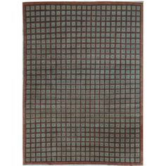 an area rug with brown and green squares on it