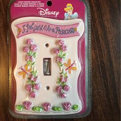 the disney princess light switch plate cover has flowers on it