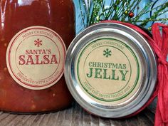 two jars of christmas jelly sitting next to each other