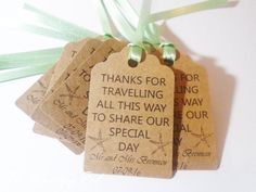 four tags with green ribbons on them that say thanks for traveling all this way to share our special day