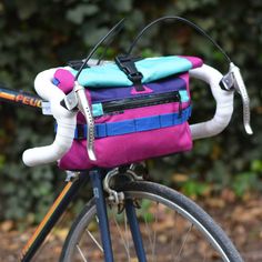 a close up of a bike with a bag on the back