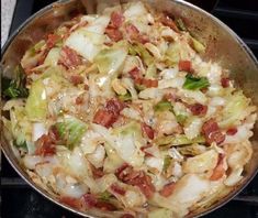 a pan filled with food sitting on top of a stove