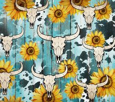 sunflowers and longhorn skulls are painted on a blue background with black spots