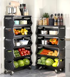 there are two black shelves with fruits and vegetables on them in the kitchen, next to each other