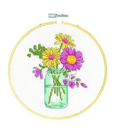 a cross stitch pattern with flowers in a mason jar