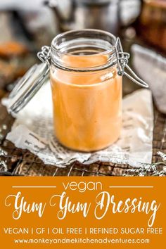 a jar filled with liquid sitting on top of a wooden table