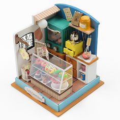 a toy house with food and drinks in it