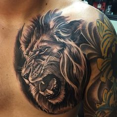 a man's chest with a lion tattoo on it, and an instagramtion