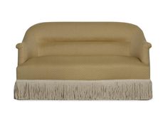 a tan chair with fringes on it