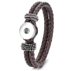 a brown leather bracelet with silver beads