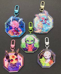 four different key chains with cartoon characters on them