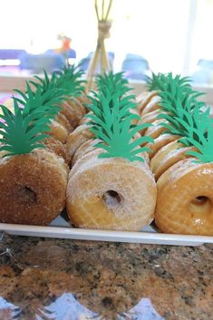 there are many donuts with pineapples on them