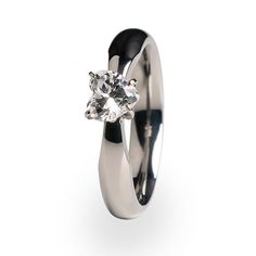 A beautiful Women's ring with a heart shaped gem.  Custom made and polished to perfection. Titanium Engagement Ring, Titanium Engagement Rings, Ring And Wedding Band Set, Black Titanium Ring, Engagement Ring And Wedding Band, Heart Center, Versace Jewelry, Bold Rings, Titanium Ring