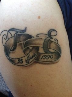 a couple of tattoos that are on the back of a woman's arm and shoulder