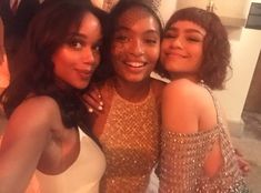 three young women posing for a photo together