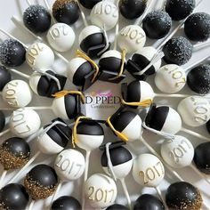 black and white cake pops are arranged in a circle