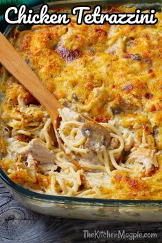 a casserole dish with pasta and meat in it, on a wooden table