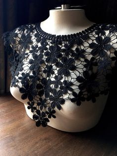 "If you're searching for a black applique that covers both back and front, this is it! Black Venise lace applique with little daisy type blooms, as pictured. Can cut these apart to yield a plethora of little flowers if you wish! * Measures 19\" around the neck edge, 10\" deep at center front * 6.5\" deep at back edges * 6\" deep at sides * Small mannequin is about size XXsm, large on is a size 8 Ladies. More lace, stretch lace, appliques, flowers, leaves and other lovelies located here: LACES: h Fitted Black Crochet Lace, Short Bridal Dress, Bodice Applique, Small Mannequin, Little Flowers, Flowers Leaves, Lace Bodice, Lace Applique, Stretch Lace