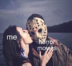 a woman kissing a man wearing a mask with the words me horror movies on it