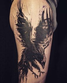 the back of a man's leg with black ink on it and an image of a