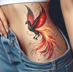 a woman's stomach with a bird tattoo on it