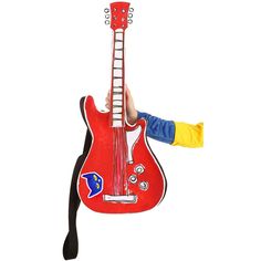 a person holding up a red guitar shaped pillow