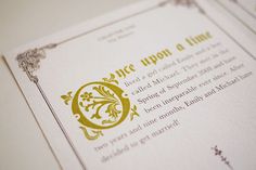 two wedding cards with the words once upon a time written in gold and silver on them