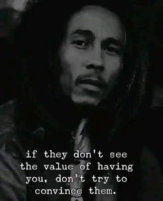 a man with dreadlocks and a quote from bob marley